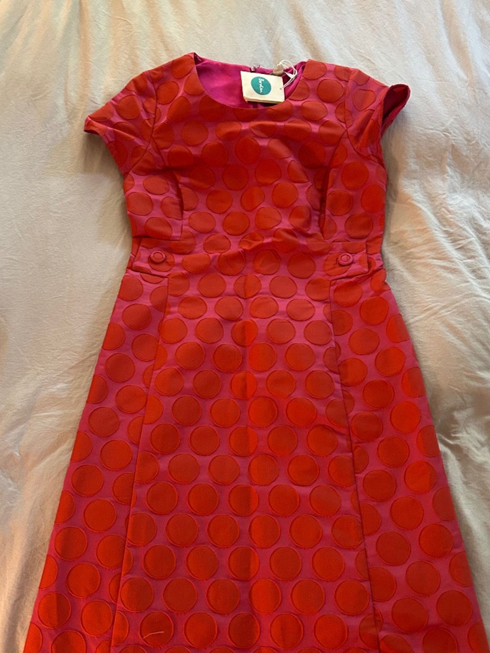 polka dotted shift dress that cinches at the waist